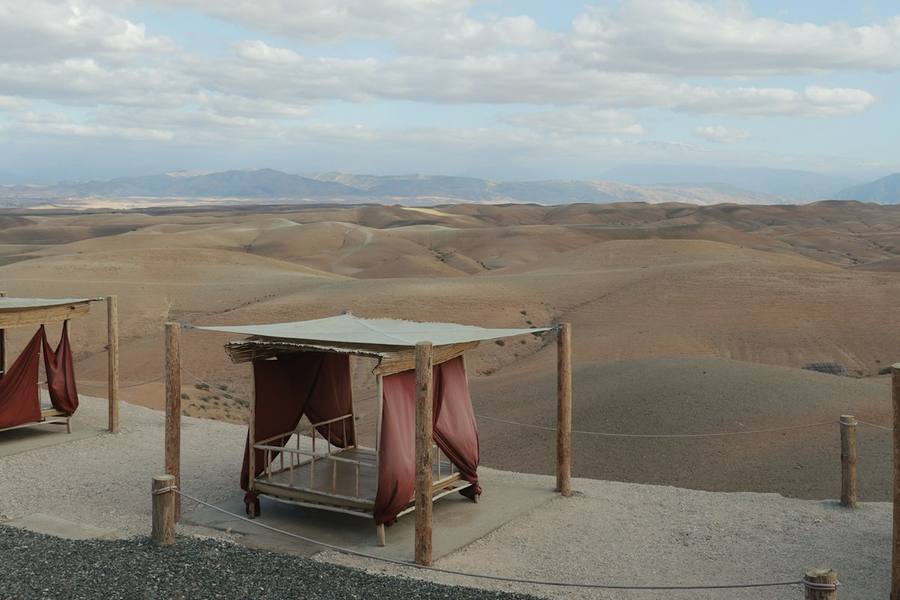 A canopied daybed overlooking the Agafay desert