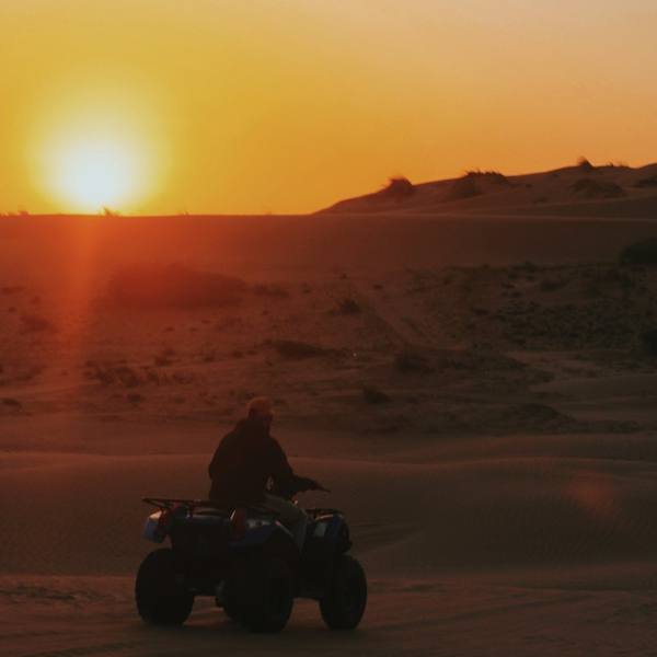 A quad bike in the Merzouga dunes at sunset